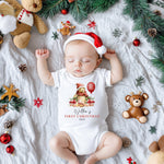 Baby's first Christmas onesie with Winnie the Pooh festive print, cosy cotton material, and easy snap closures for quick changes