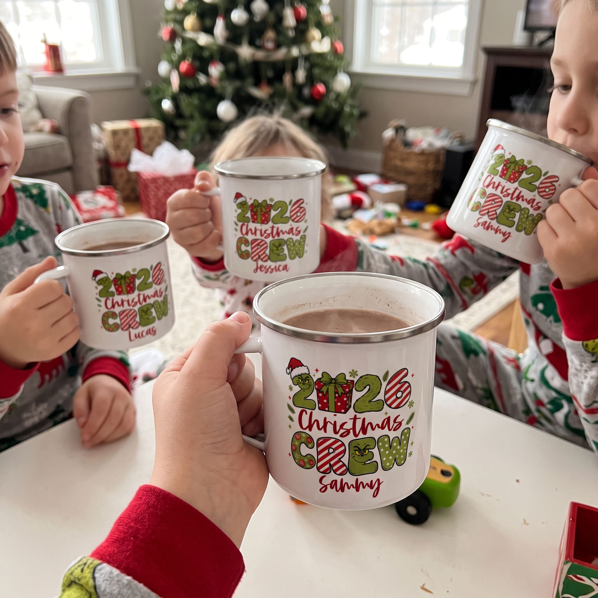 Children drinking hot chocolate from personalised Christmas Crew enamel mugs on Christmas morning