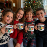 Four cousins in Christmas jumpers holding their own personalised Santa Cousin Crew enamel mugs - The Custom Co