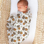 Custom muslin swaddle wrap personalized with baby’s name, made from soft breathable fabric, ideal for newborns.
