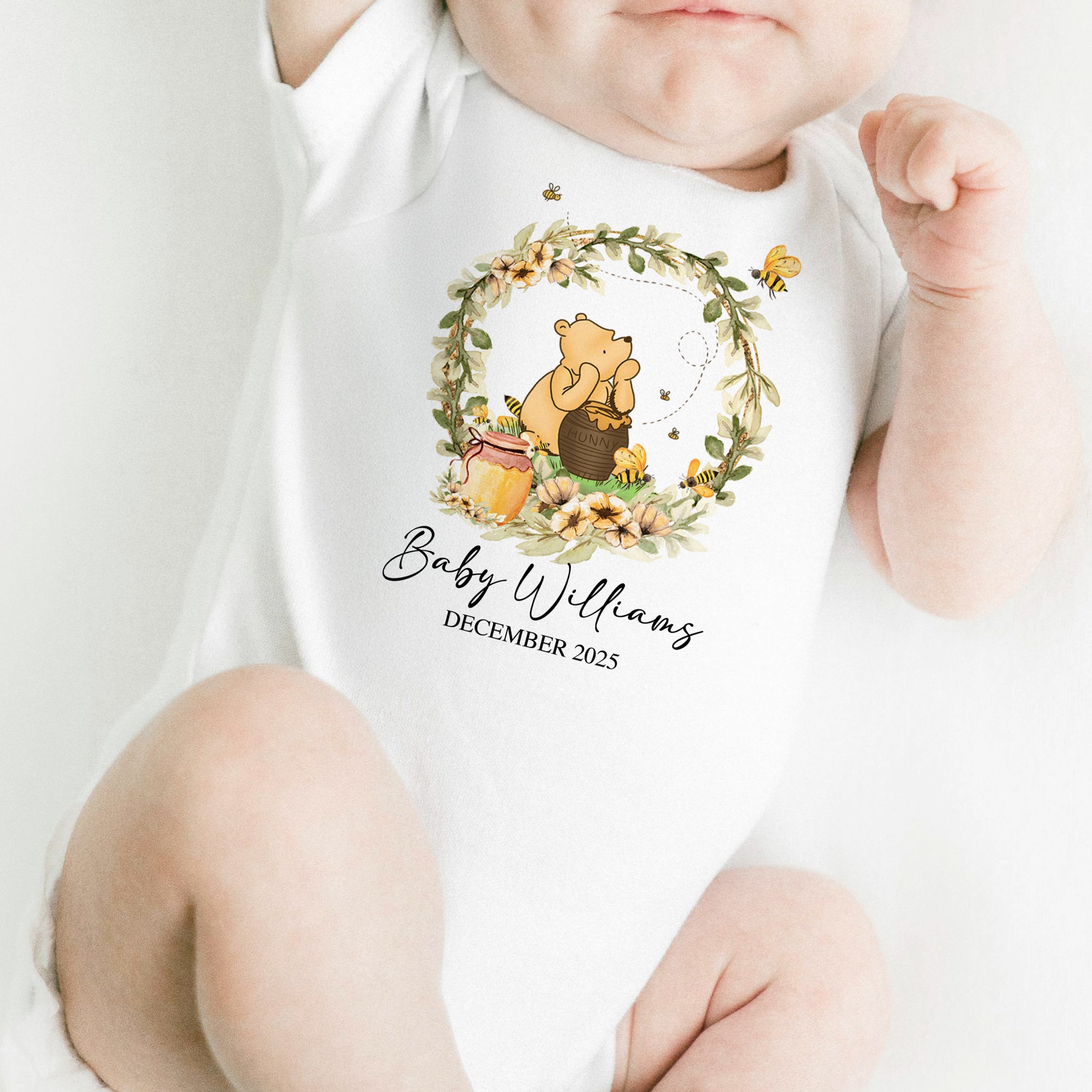 Newborn wearing Hunny Baby Onesie with Winnie the Pooh design – soft cotton baby outfit for newborn photos or baby shower gifts