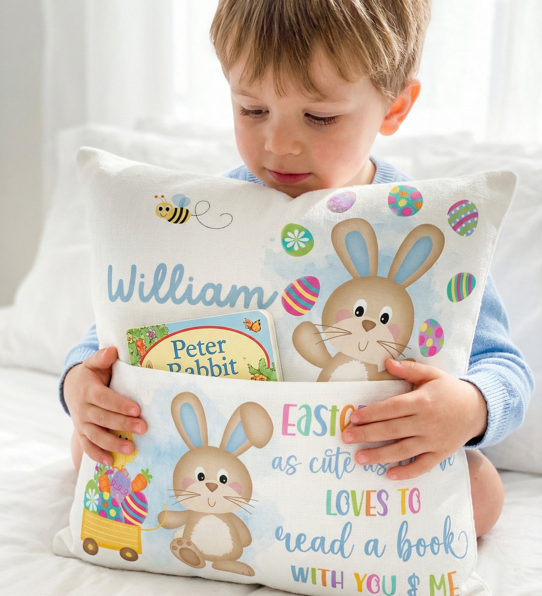 Blue personalised Easter pocket book cushion with bunny design and name pocket for kids' books