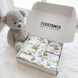 Personalised newborn essentials gift bundle with minky blanket, jersey swaddle, matching beanie, muslin swaddle, and 6-in-1 nursing cover baby box